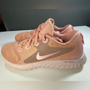 Nike Legend React running shoes in the Rust Pink colorway.